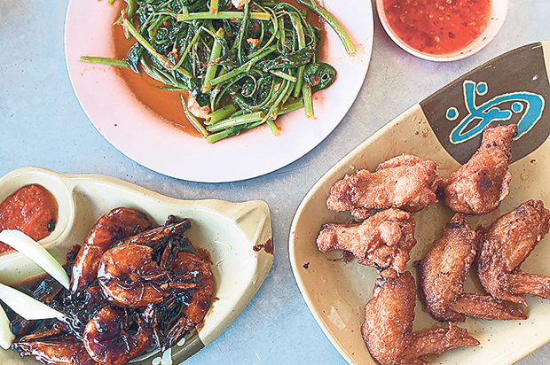 Home cooked-style dishes such as asam prawns (left), kangkung fried with sambal (top) and belacan chicken