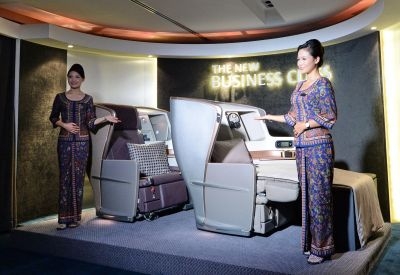Singapore Airlines (SIA) stewardesses stand next to a display of the new Singapore Airlines Business Class seats during their next generation cabin product launch in Singapore on July 9, 2013. u00e2u20acu201c AFP pic