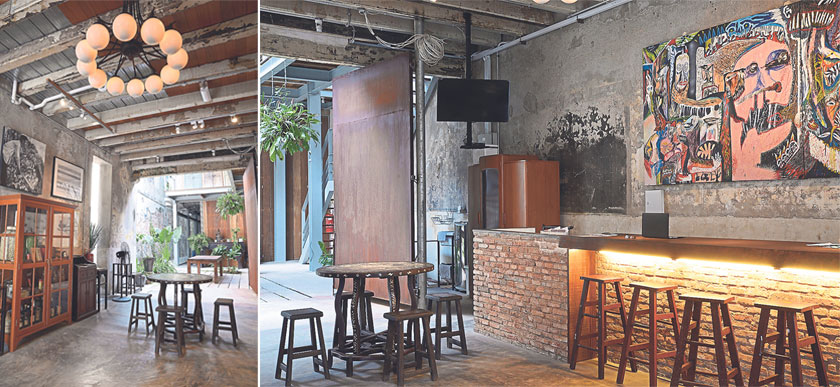 A touch of the heritage is also present at the fully refurbished shophouse evident in the original exposed wooden beams in the ceiling (left). The reception area of Sinkeh adorned with a large painting by a local artist (right)