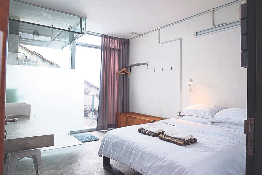 Sinkeh has nine compact minimalist modern rooms with a wall of glass to let in plenty of natural light