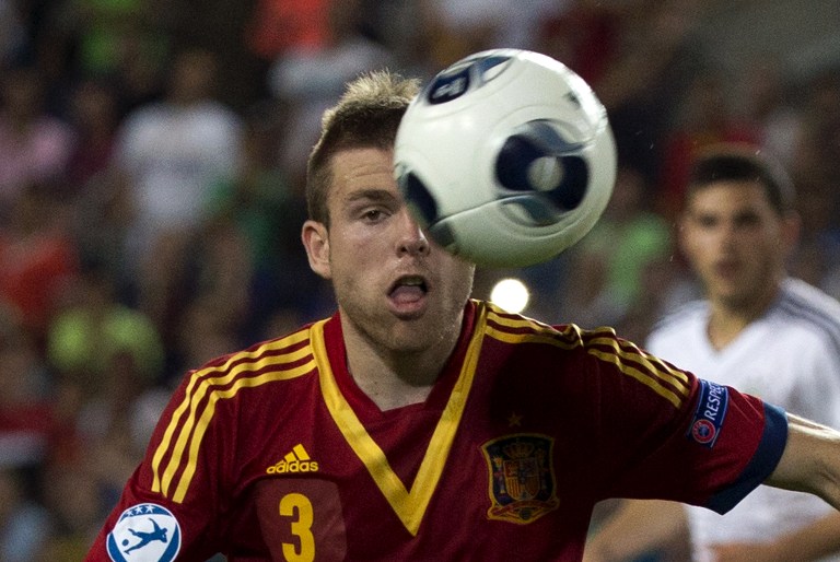 Spain's midfielder Asier Illarramendi heads the ball during the 2013 UEFA U-21 Championship group B football match between Germany and Spain in the coastal city of Netanya, north of Tel Aviv, on June 9, 2013. 