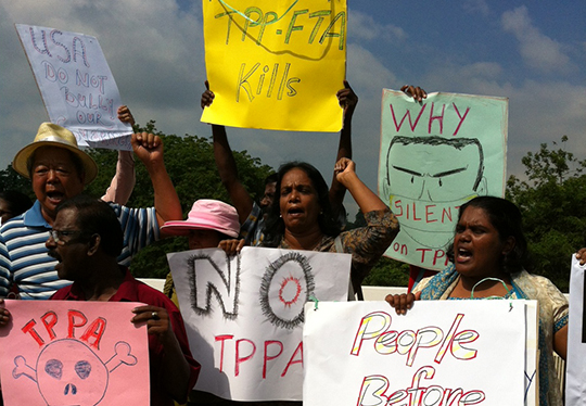  Anti-TPPA demonstrators outside Parliament on July 16, 2013 urge Malaysia to postpone its participation in the trade deal. u00e2u20acu201c Picture by Boo Su-Lynn