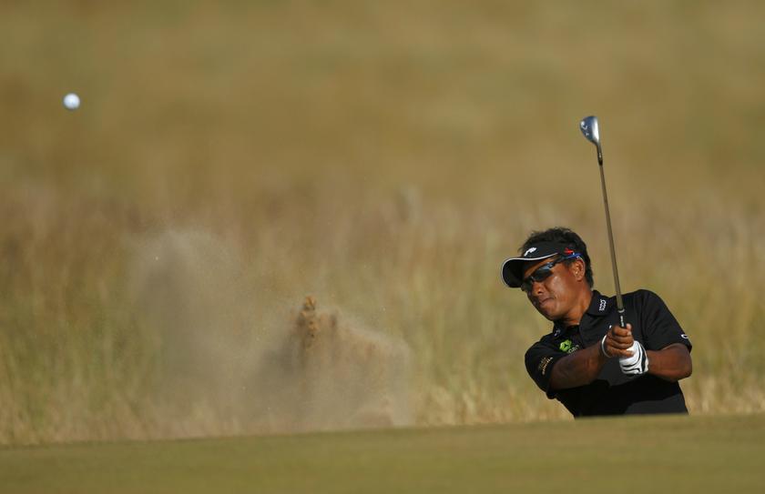 Thongchai Jaidee of Thailand hits out of a bunker on the fifth hole during the second round of the British Open golf Championship at Muirfield in Scotland July 19, 2013. u00e2u20acu201c Reuters pic
