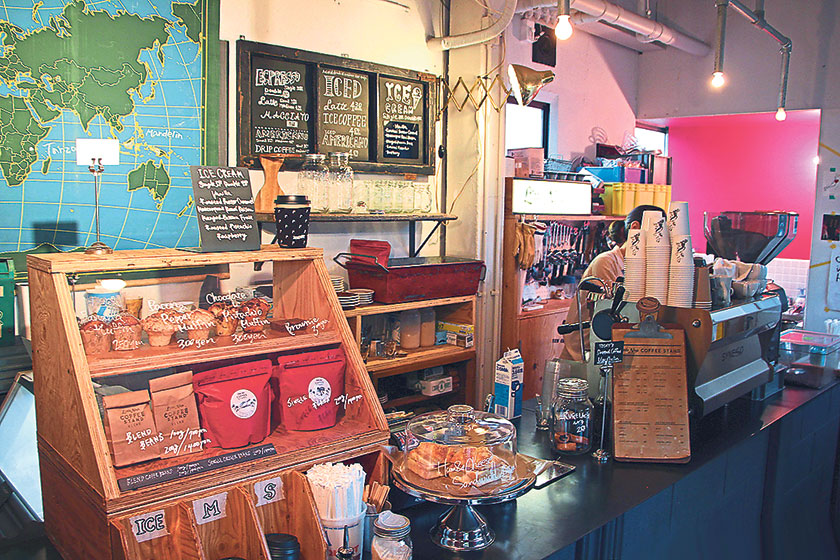 The Bohemian-chic interior of Little Nap Coffee Stand, with custom-built wooden counters