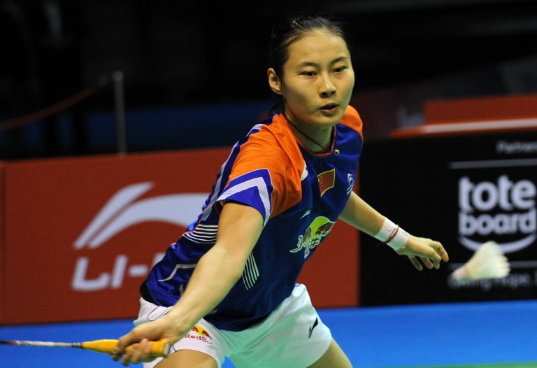 China's Wang Yihan hits a return against compatriot Li Xuerui during their women's singles final badminton match at the Singapore Open on June 23, 2013. 