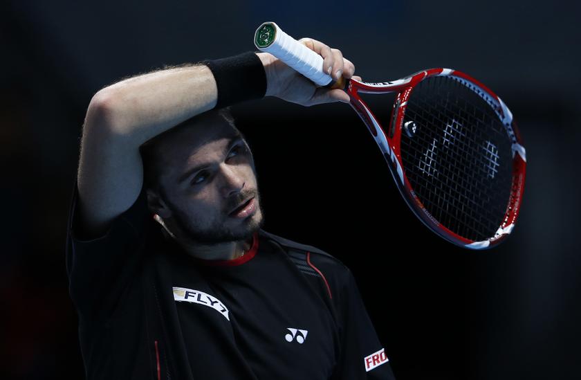 Stanislas Wawrinka of Switzerland wipes his forehead during his men’s singles tennis match against Rafael Nadal of Spain at the ATP World Tour Finals at the O2 Arena in London November 6, 2013. — Reuters pic