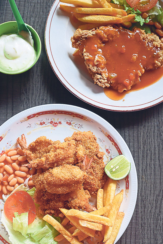Fish and prawns and Hainanese chicken chop served at the Western food stall in Esplanade