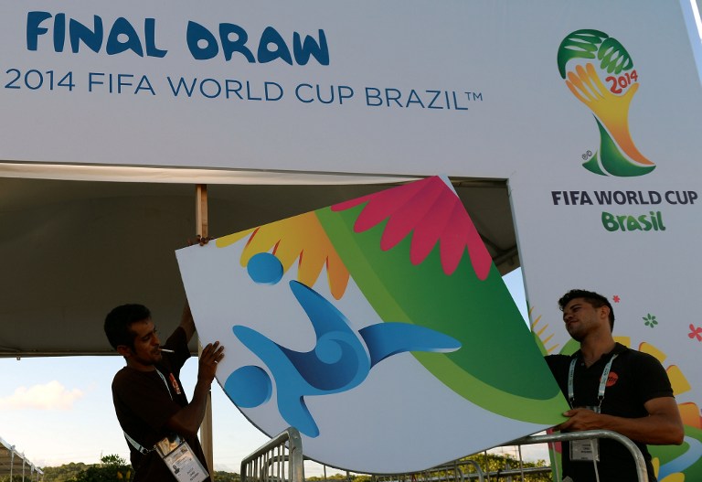 Workers put finishing touches to the entrance to the complex where the Brazil 2014 FIFA World Cup final draw will take place in Costa do Sauipe, on December 2, 2013. u00e2u20acu201d AFP pic