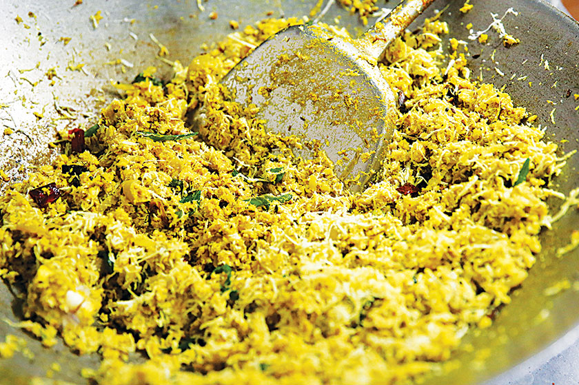 The shark meat is shredded and cooked with turmeric, coconut and spices.