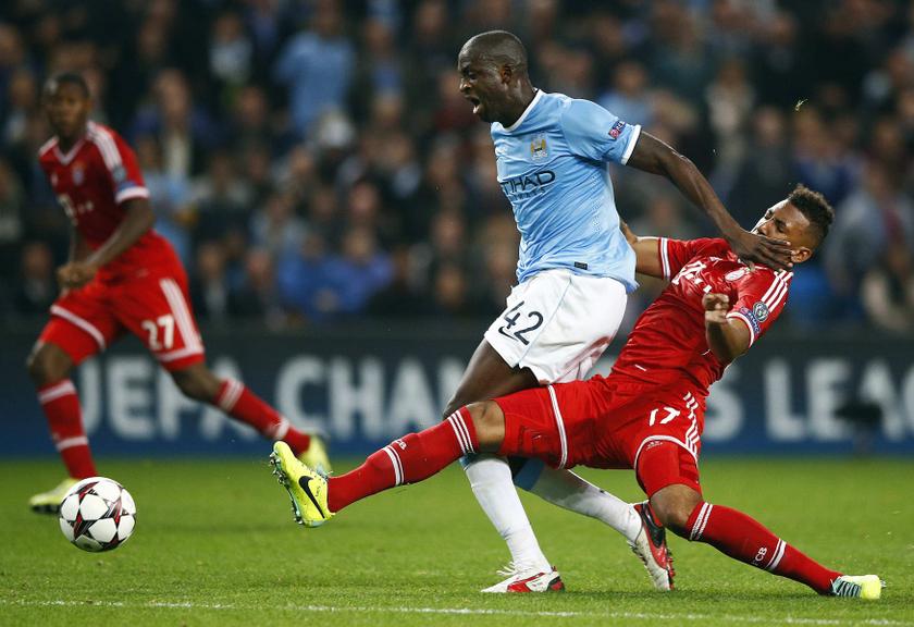 Bayern Munich's Jerome Boateng (right) challenges Manchester City's Yaya Toure during their Champions League football match on October 2, 2013. u00e2u20acu201d Reuters pic