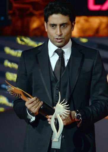 Actor Abhishek Bachchan reacts after receiving his award for Best Performance in a Comic Role. — AFP pic