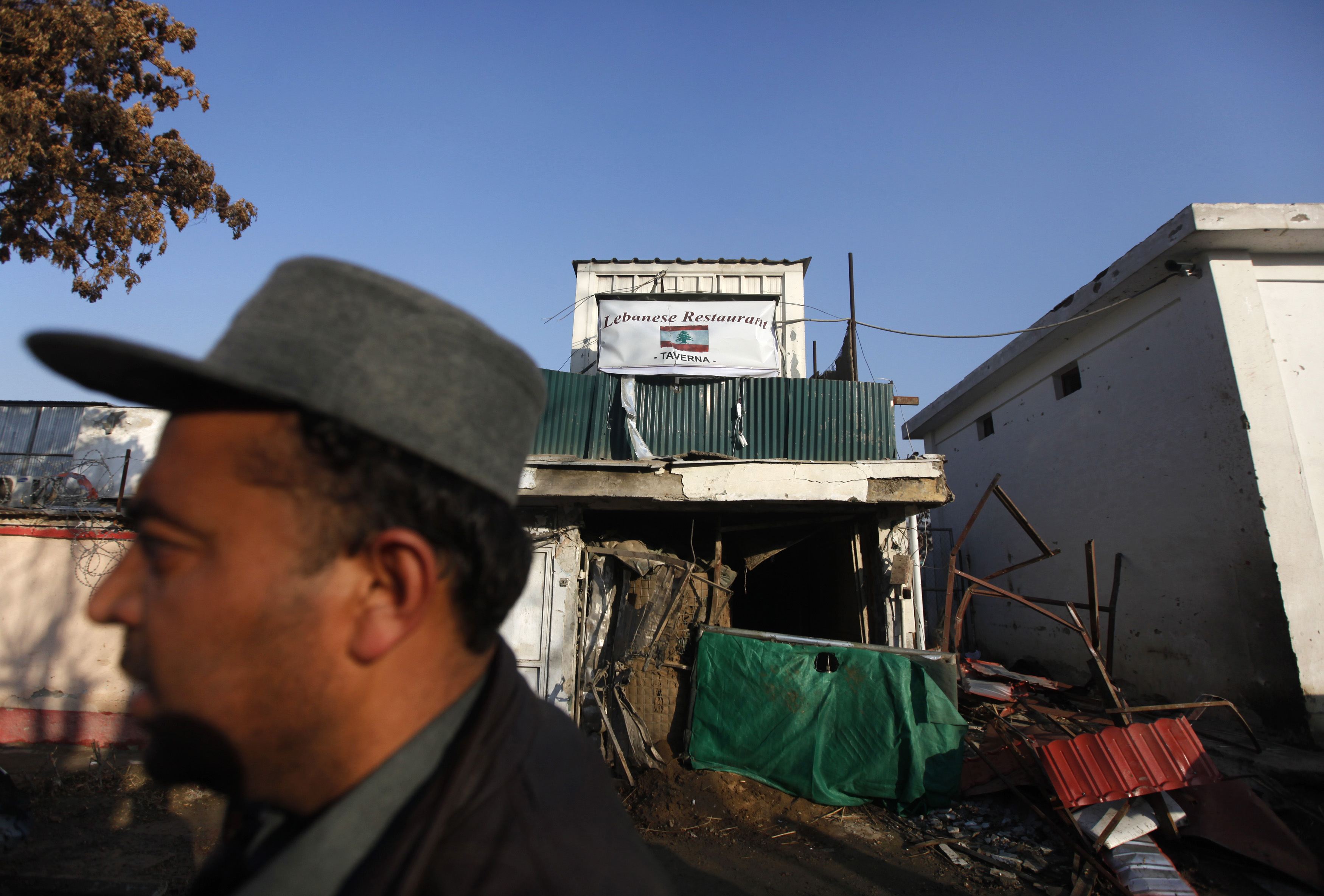 An Afghan policeman stands outside a Lebanese restaurant, the site of a suicide attack, in Kabul January 18, 2014. u00e2u20acu201d Reuters pic