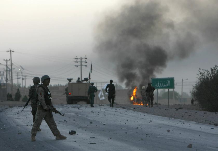 Afghan soldiers walk towards flames outside the US Consulate after an attack by insurgents, in Herat province Sept 13, 2013. u00e2u20acu201d Reuters pic