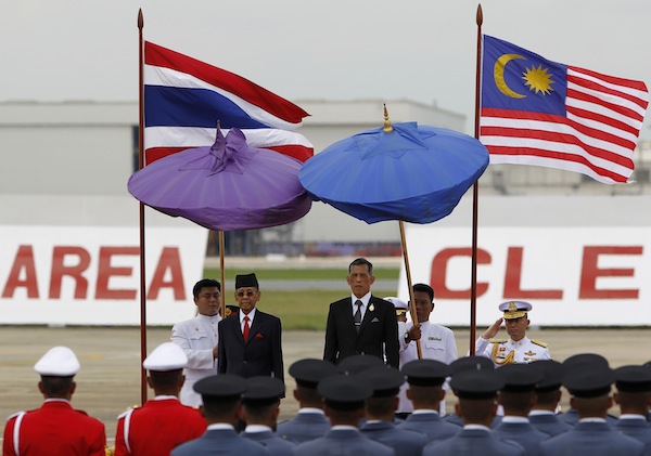 Yang di-Pertuan Agong, Tuanku Abdul Halim Mu'adzam Shah and Thailandu00e2u20acu2122s Crown Prince Maha Vajiralongkorn stand on the podium during a welcome ceremony at the Royal Military Airport in Bangkok September 2, 2013. u00e2u20acu201d Reuters pic