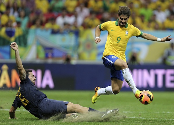 Brazilu00e2u20acu2122s Alexandre Pato challenges Australiau00e2u20acu2122s Sasa Ognenovski during their international friendly match in Brasilia September 7, 2013. u00e2u20acu201d Reuters pic