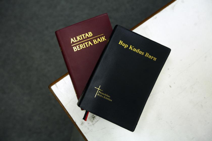Two copies of the Bible in Malay (left) and the Iban dialect are seen in this picture illustration taken in Kuala Lumpur January 2, 2014. u00e2u20acu201d Reuters pic