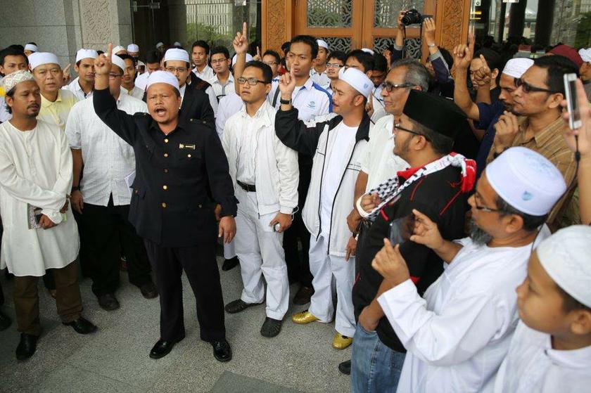 Another section of the crowd outside the court today.