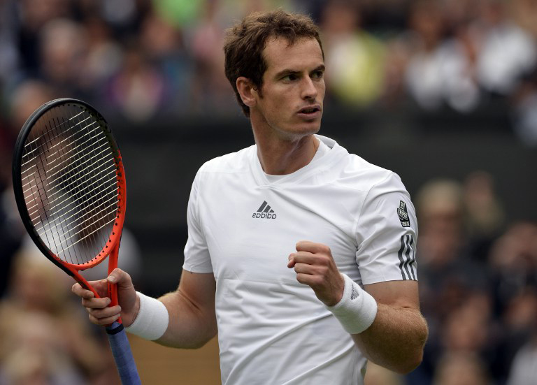 Andy Murray celebrates beating Germany's Benjamin Becker during their men's first round match on day one of the 2013 Wimbledon Championships tennis tournament at the All England Club in Wimbledon, southwest London, on June 24, 2013. - AFP pic