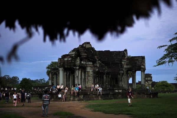 Tourists visit the world heritage Angkor Wat temple during sunrise in Siem Reap province, some 300 kilometres northwest of Phnom Penh on July 14, 2012. u00e2u20acu201d AFP pic