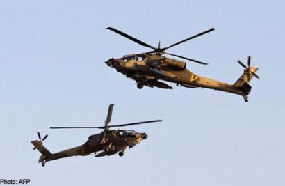 AH-64 Apache longbow helicopters fly during an air show at the graduation ceremony of Israeli air force pilots in the Negev desert, on June 27, 2013. u00e2u20acu201d AFP pic