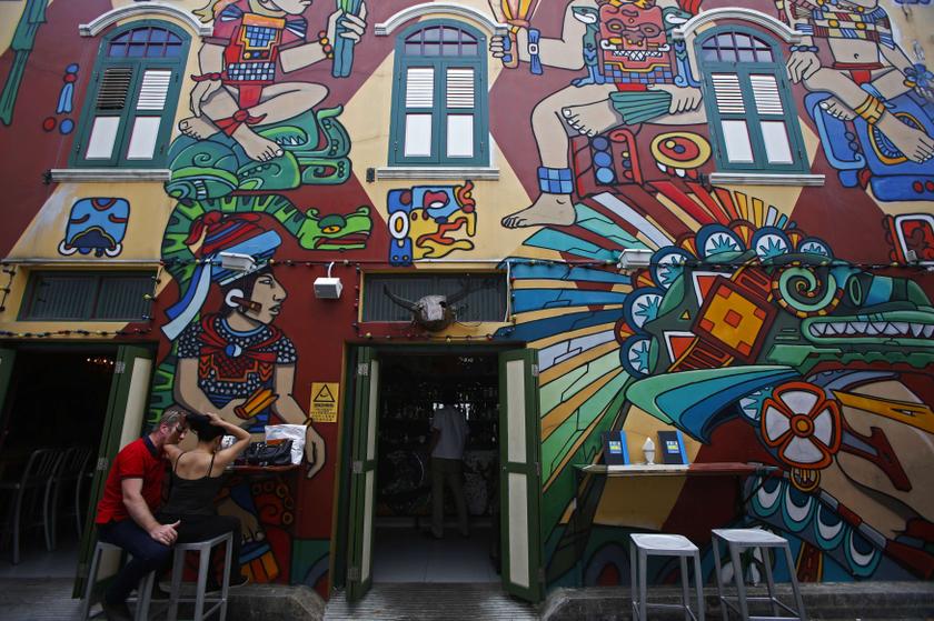 Patrons sit outside a pub at Arab Street in Singapore in a photo released on February 7, 2014. u00e2u20acu201d Reuters pic