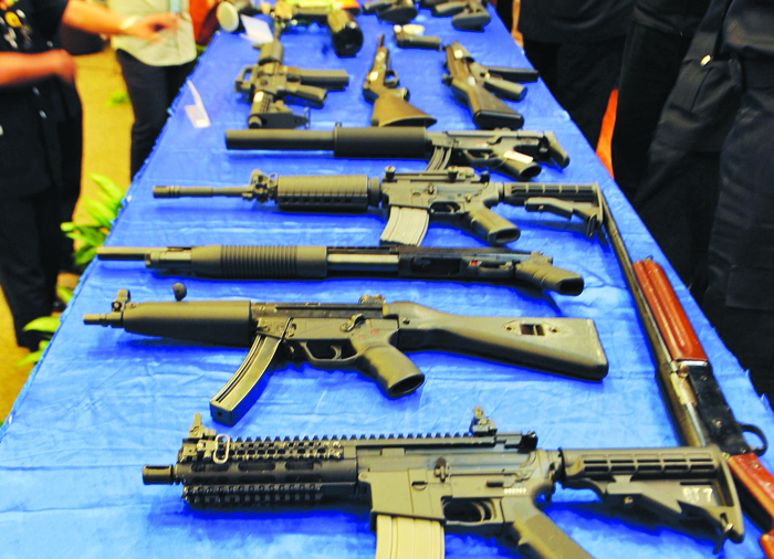 Airsoft guns, paintball markers and replica guns on display in Bukit Aman during the press conference yesterday. u00e2u20acu201d Picture by Firdaus Latif