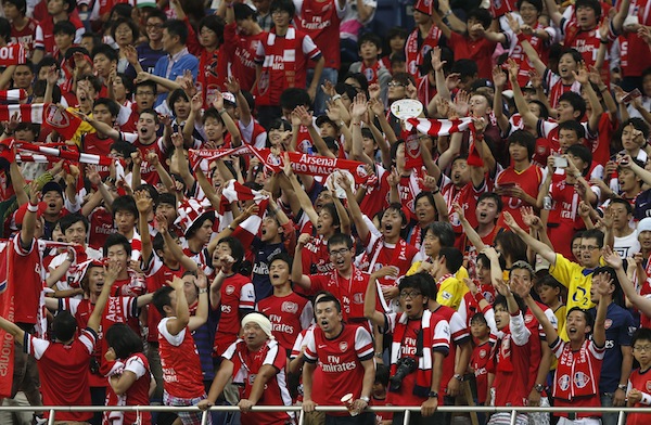 Supporters of Arsenal cheer their team before their friendly match against Urawa Reds as part of Arsenalu00e2u20acu2122s Asia Tour 2013 in Saitama, north of Tokyo July 26, 2013. u00e2u20acu201d Reuters pic