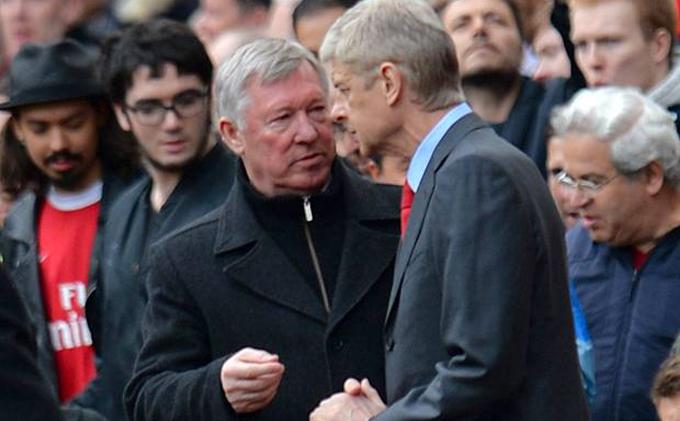 Arsenal's manager Arsene Wenger (right) speaks with Manchester United's manager Alex Ferguson (left) before the English Premier League match between Arsenal and Manchester United at The Emirates Stadium in north London on April 28, 2013. u00e2u20acu201d AFP pic