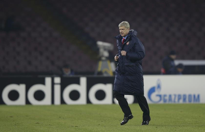 Arsenal's coach Arsene Wenger leaves the pitch at the half-time of the the Champions League match against Naples at San Paolo stadium in Naples, December 11, 2013. u00e2u20acu201d Reuters pic