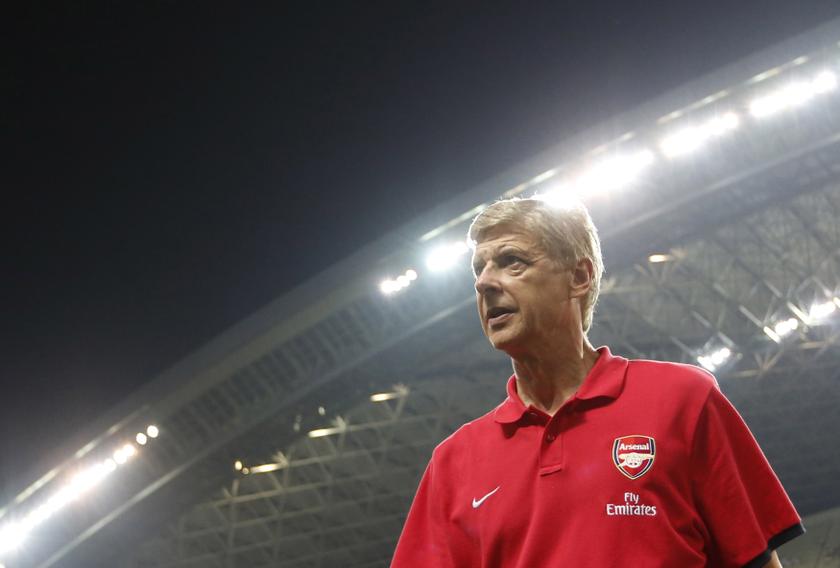 Arsenal's manager Arsene Wenger looks at his players before their friendly match against Urawa Reds, as part of Arsenal's Asia Tour 2013, in Saitama, north of Tokyo July 26, 2013. u00e2u20acu201c Reuters pic