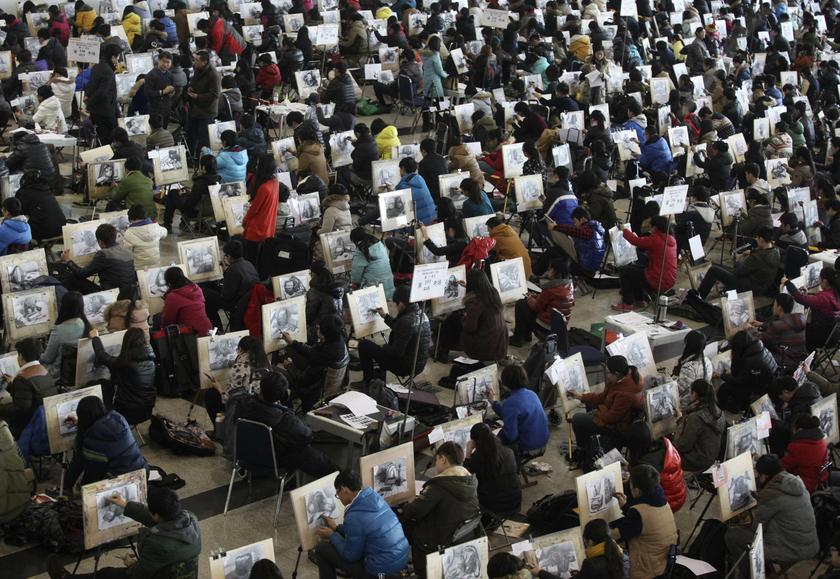 Students draw sketches during an art college entrance exam in Jinan, Shandong province, February 10, 2014. According to local media, more than 8000 students took the exam today. u00e2u20acu201d Reuters pic