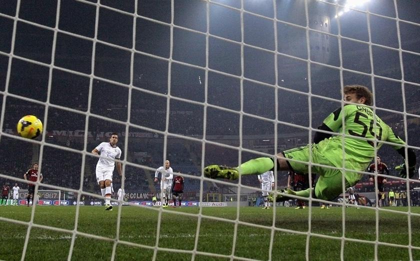 AS Roma's Kevin Strootman (second left) shoots to score a penalty past AC Milan's goalkeeper Gabriel during their Italian Serie A match at San Siro stadium in Milan December 16, 2013. u00e2u20acu201d Reuters pic