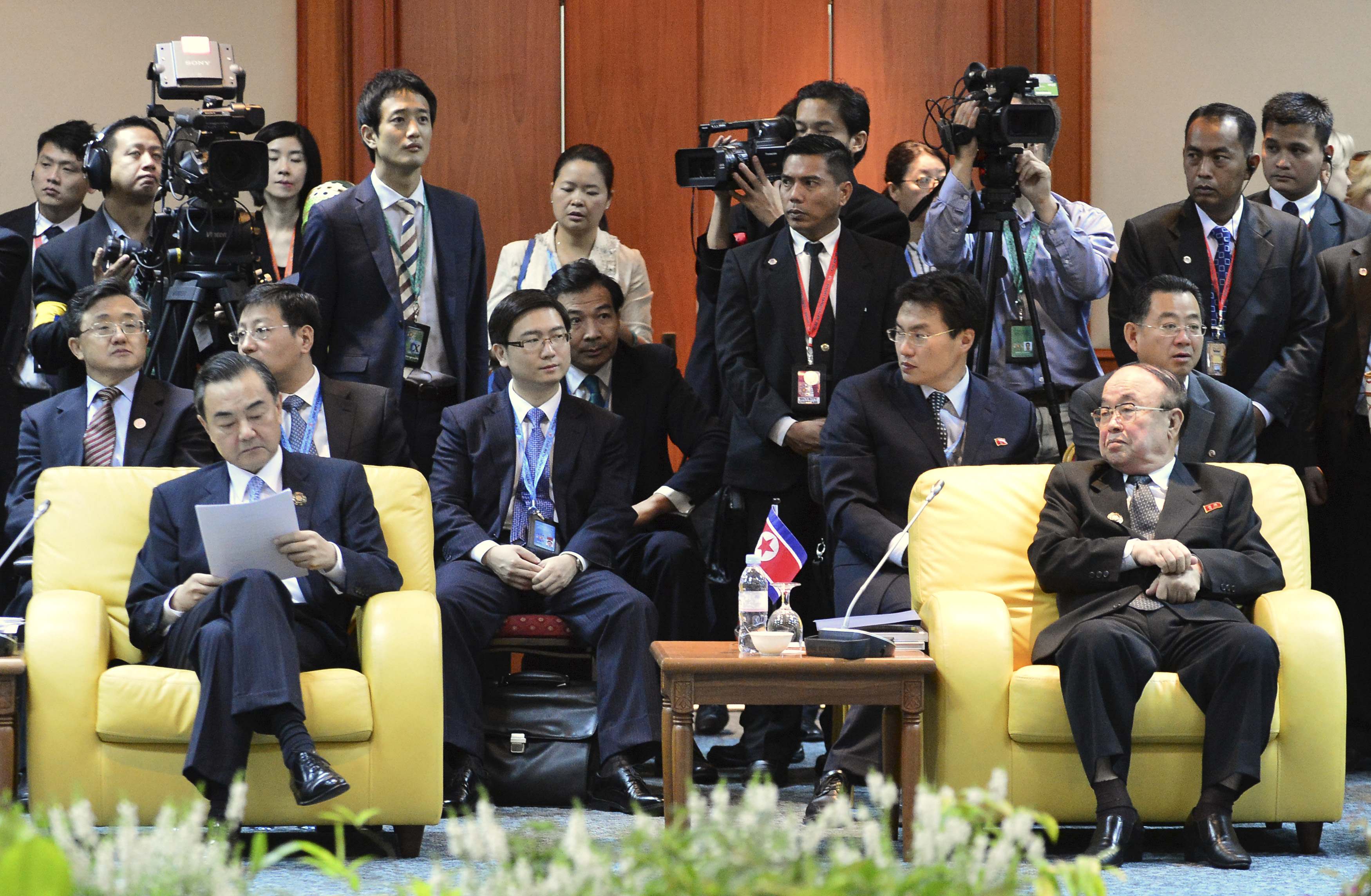 China's Foreign Minister Wang Yi (left) and his North Korean counterpart Pak Ui-Chun wait for a retreat session during the 20th ASsean Regional Forum in Bandar Seri Begawan July 2, 2013. u00e2u20acu201d Reuters pic