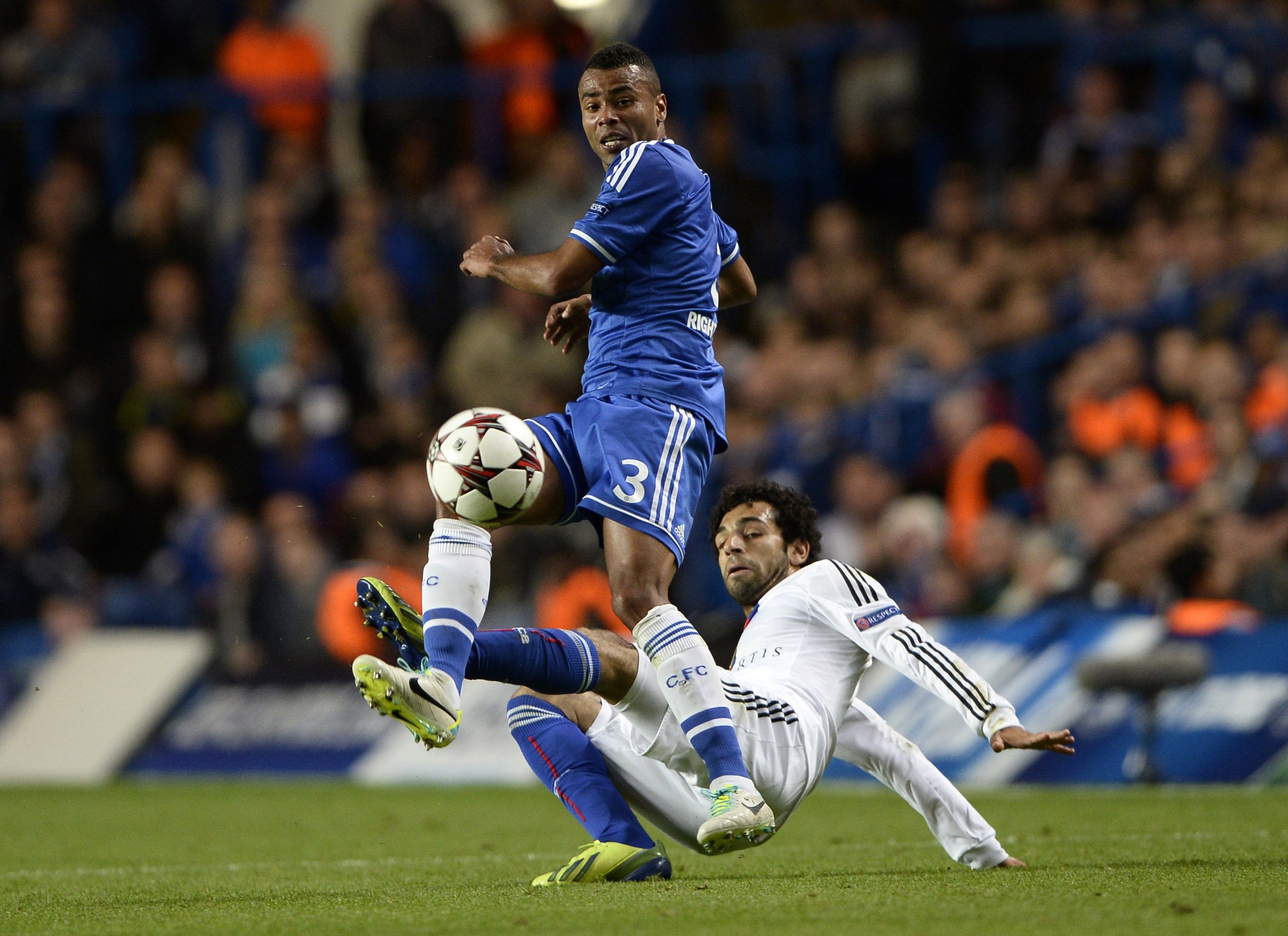 Chelsea's Ashley Cole (left) challenges Basel's Mohamed Salah during their Champions League match at Stamford Bridge in London September 18, 2013. u00e2u20acu201d Reuters pic