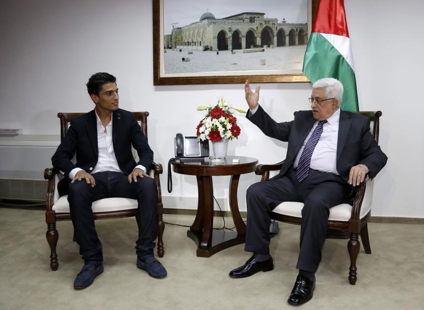 'Arab Idol' Mohammed Assaf (left) sits next to Palestinian President Mahmoud Abbas during their meeting in the West Bank city of Ramallah July 1, 2013.