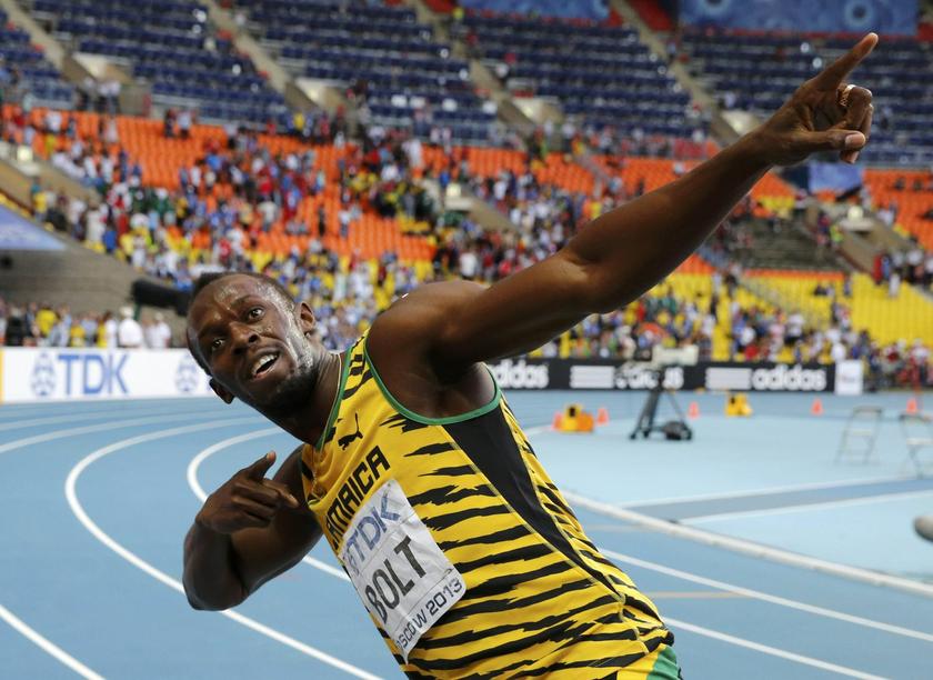Winner Usain Bolt of Jamaica celebrates after the men's 200 metres final during the IAAF World Athletics Championships at the Luzhniki stadium in Moscow August 17, 2013