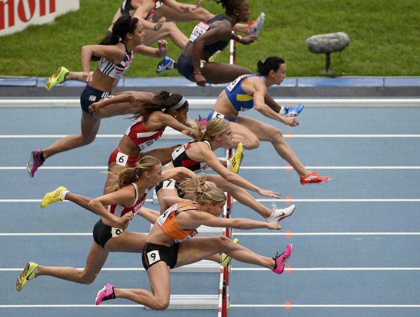 Competitors clear a barrier in the 100 metres hurdles during the womenu00e2u20acu2122s heptathlon at the IAAF World Athletics Championships in the Luzhniki stadium in Moscow on August 12, 2013. u00e2u20acu201d Reuters pic