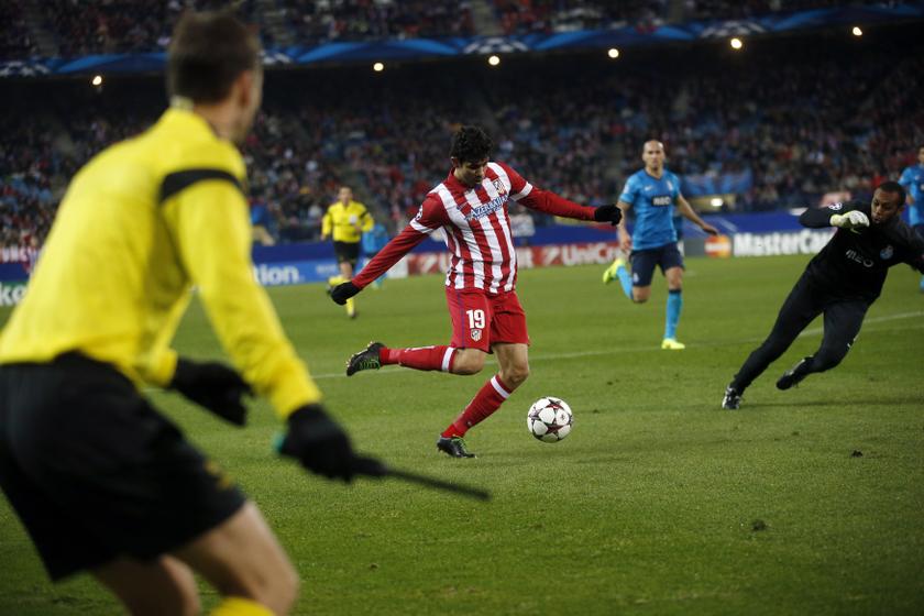 Atletico Madridu00e2u20acu2122s Diego Costa (centre) shoots to score during their Champions League match against Porto at Vicente Calderon stadium in Madrid December 11,  2013. u00e2u20acu2022 Reuters pic