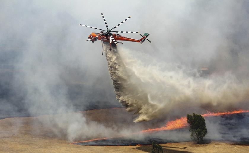 A helicopter dumps water on a bushfire burning in the Grampians bushland in the southeastern Australian state of Victoria, about 300km west of Melbourne January 17, 2014. u00e2u20acu201d Reuters pic