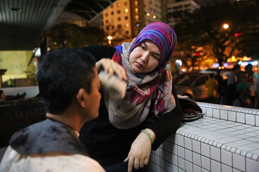 Azmina says that she merely separates the equipment she uses for the homeless from the tools for the customers at her salon in Damansara Heights.