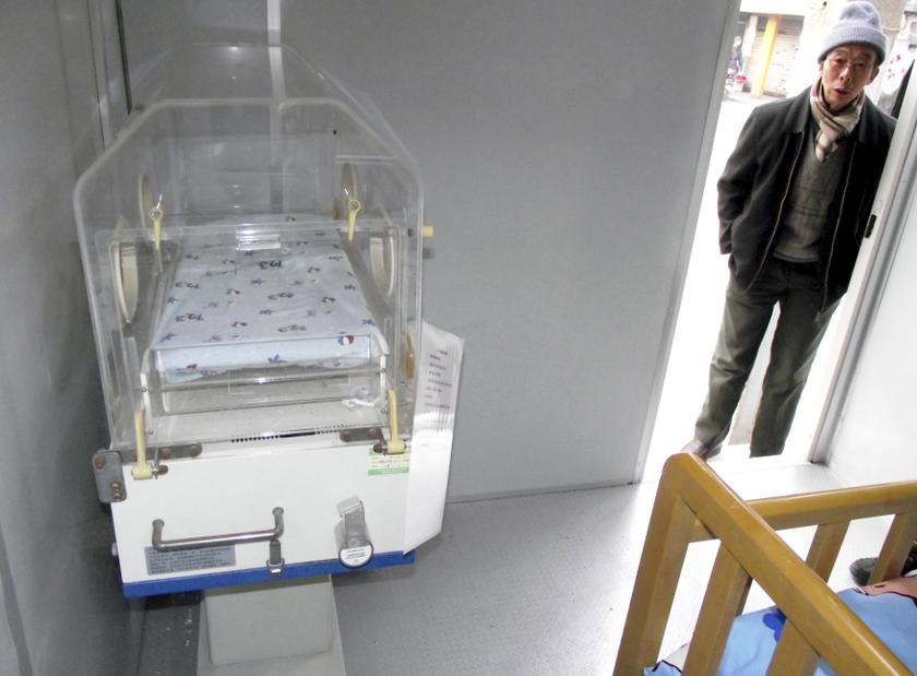 A man stands outside the cityu00e2u20acu2122s first baby hatch in Nanjing, Jiangsu province, December 11, 2013. u00e2u20acu201d Reuters pic