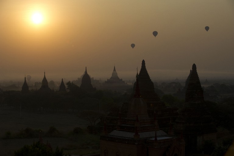 This file picture taken on February 26, 2012 shows hot air balloons carrying tourists above pagodas as the sun rises in the ancient city of Bagan in northern Myanmar. u00e2u20acu201d AFP pic