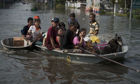 Some people travelling on a 'khlong'. u00e2u20acu201d AFP pic