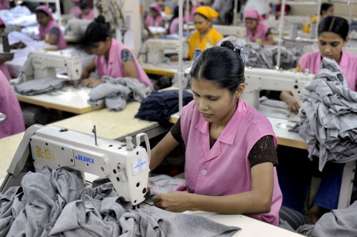 In this photograph taken on March 18, 2009, Bangladeshi garment workers sew T-shirts at a factory in Dhaka. u00e2u20acu201d AFP pic