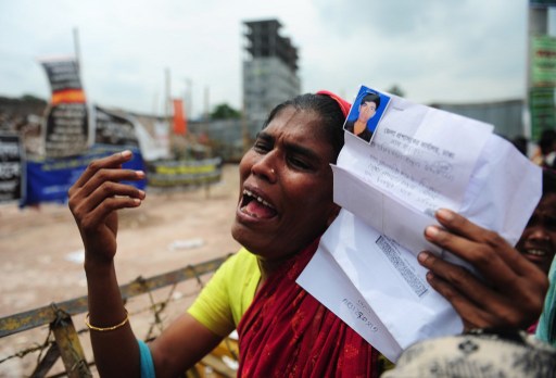 A family member cries for her missing relative, believed to have died in the rubble, two months after the nine-storey building collapse in Savar, on the outskirts of Dhaka on June 24, 2013. u00e2u20acu201d AFP pic