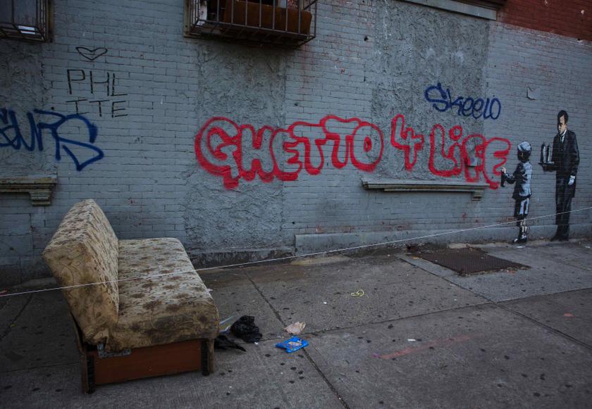 An installation by British graffiti artist Banksy is pictured in the Bronx section of New York October 21, 2013. REUTERS/Eric Thayer