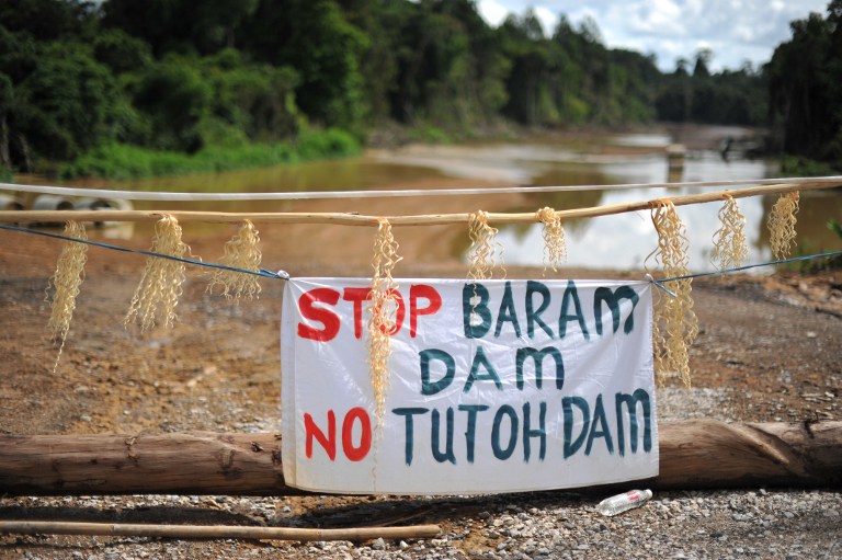 This picture taken on November 16, 2013 shows a banner reading 'Stop Baram Dam' are seen on the main entrance near the first blockade camp of the proposed dam on the Baram River in Long Lama, in Sarawak. u00e2u20acu201d AFP pic