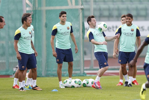 Barcelonau00e2u20acu2122s Lionel Messi (second right) controls a ball during a training session at Bislet stadium in Oslo July 25, 2013. u00e2u20acu201d Reuters pic