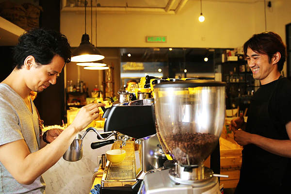 Travelling baristas Junichi Yamaguchi (left) and Masa Aoki (right) sharing a laugh. u00e2u20acu201d Picture by Choo Choy May