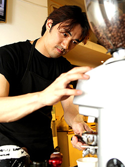 Barista trainer Masa Aoki grinding coffee beans. — Picture by Choo Choy May